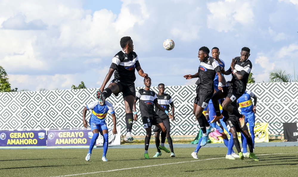 APR FC and Rayon Sports players vie for the ball during a past derby at Huye stadium. Olivier Mugwiza