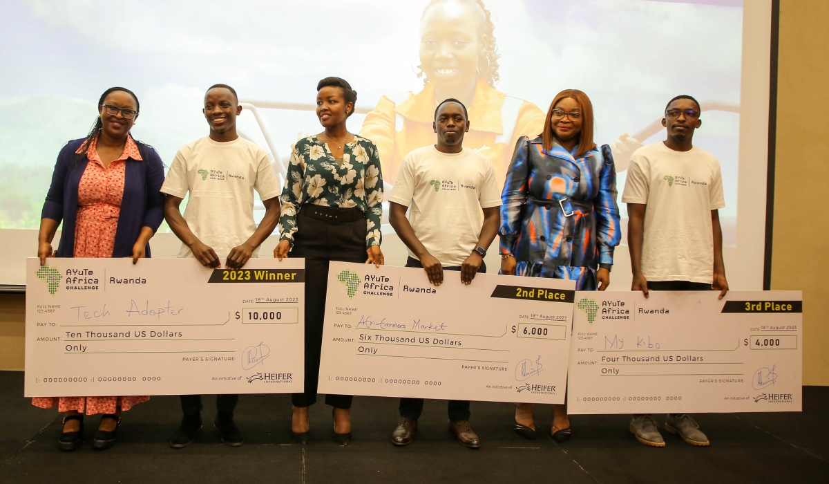 Minister of ICT Paula Ingabire (c) in a photo with winners as Heifer International Rwanda honored three exceptional young agri-tech innovators in Rwanda on Friday, August 18. All Photos by Craish Bahizi