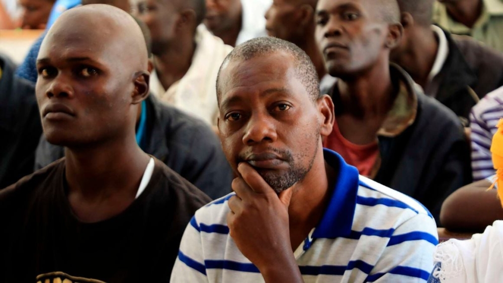 Pastor Paul Mackenzie (C) follows proceedings at the Shanzu Law Courts in Kilifi County, Kenya during the mention of his matter on July 3, 2023. Photo by Kevin Odit _ NMG