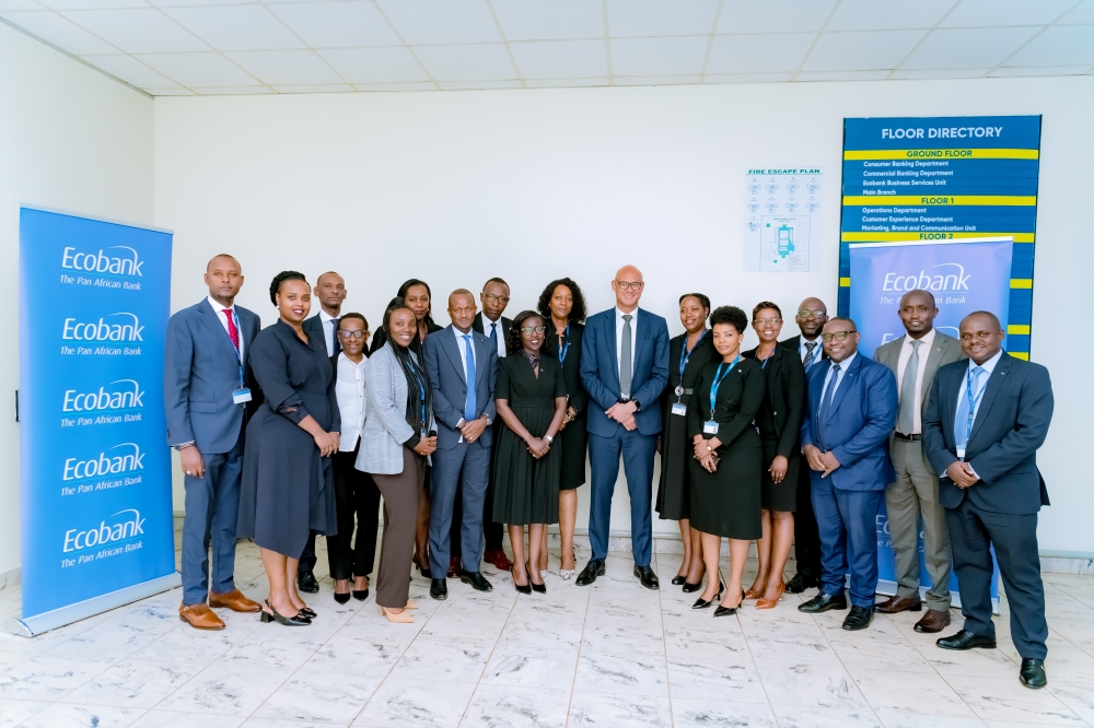 Ecobank Rwanda staff pose for a group photo with Jeremy Awori, the CEO of Ecobank Transnational Group during the visit in Rwanda. Courtesy 