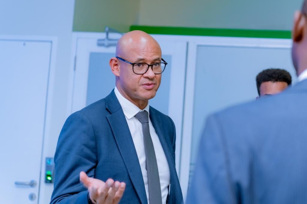 Jeremy Awori, the CEO of Ecobank Transnational Group interacts with employees at the bank's main branch in Kigali Jeremy Awori, the CEO of Ecobank Transnational Group interacts with employees at the bank's main branch in Kigali