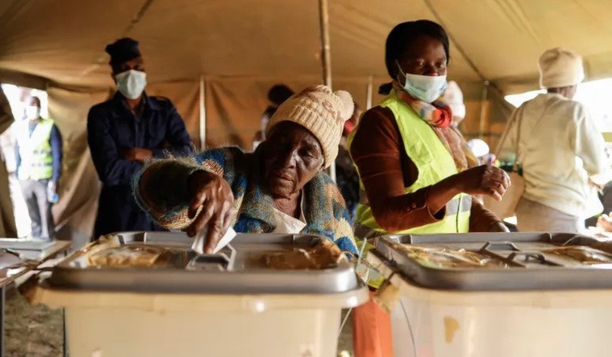 A woman casts her ballot at a polling station in Mbare, Harare [John Wessels - AFP]