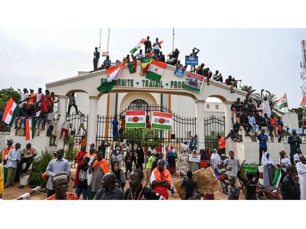 Coup supporters gather to stage a demonstration to protest the decision of the Economic Community of West African States (ECOWAS) countries to sanction Niger and to support the army, in Niamey, Niger
