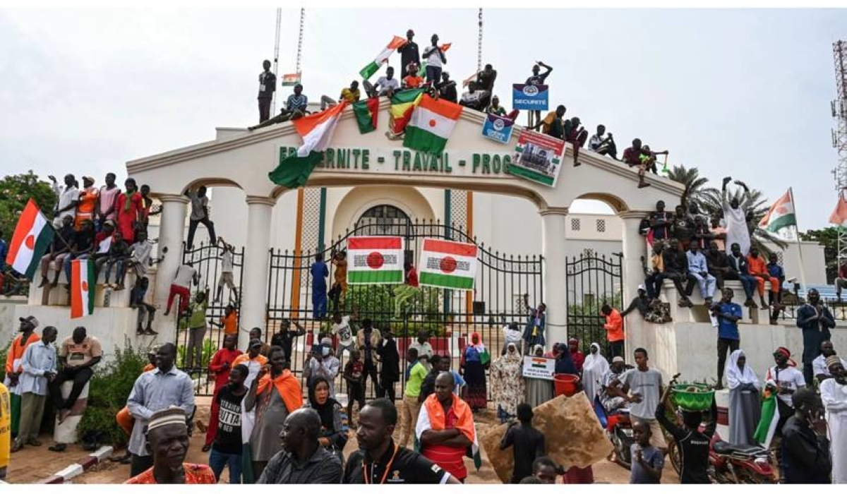 Coup supporters gather to stage a demonstration to protest the decision of the Economic Community of West African States (ECOWAS) countries to sanction Niger and to support the army, in Niamey, Niger