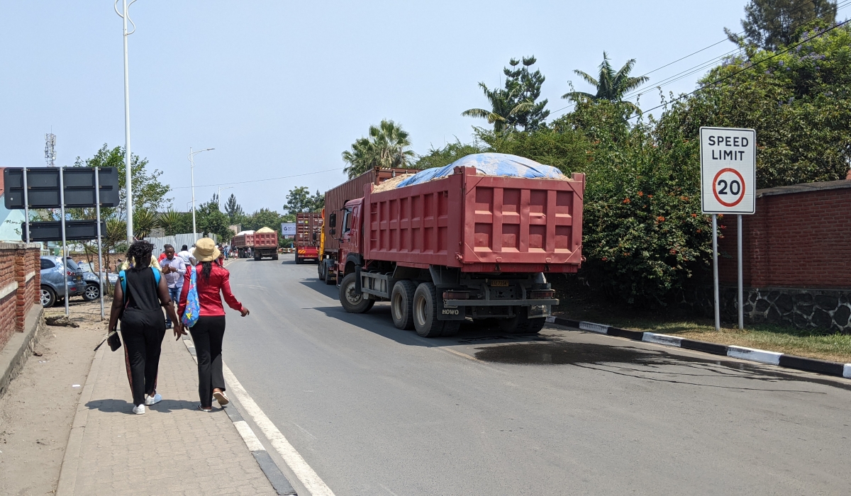 Heavy trucks carrying sand cross into Goma town via Grande Barrière Border Post. PHOTO BY GERMAIN NSANZIMANA