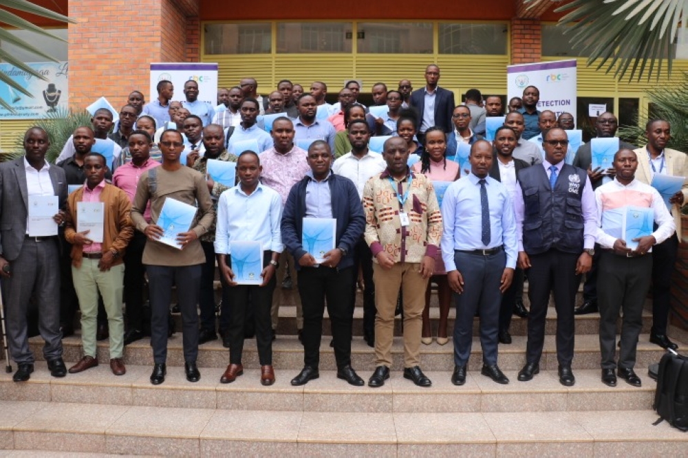 Participants pose for photo during the launch of five books offering guidelines to parents and caregivers on early detection, prevention and treatment of disabilities among the young children. Courtesy