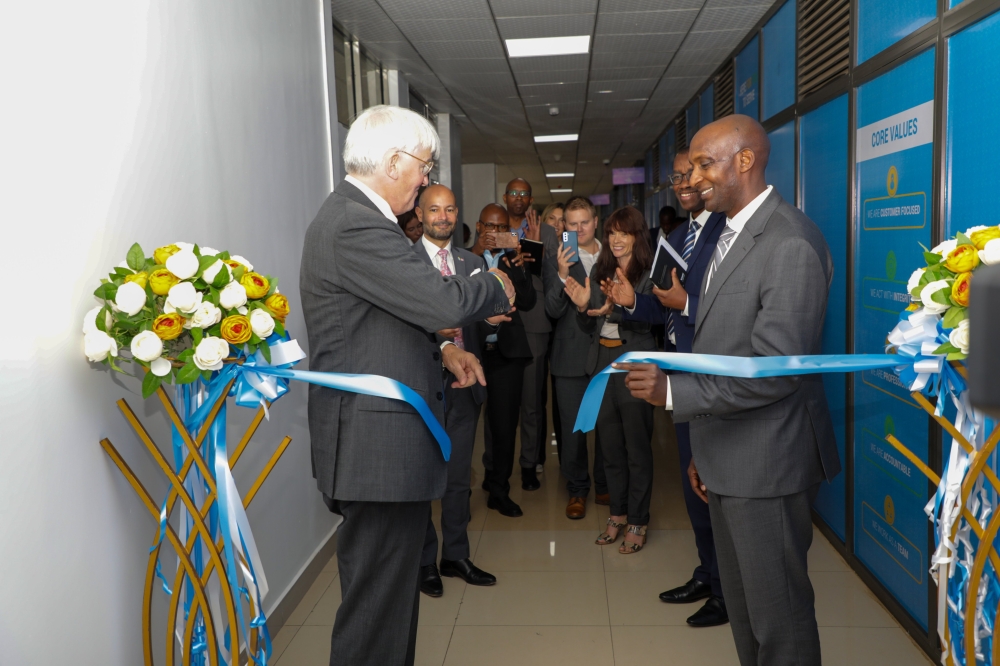 UK Minister of State for Development and Africa, Andrew Mitchell (L) and Rwanda&#039;s Minister of State in charge of National Treasury, Richard Tusabe inaugurating the Office of Exchange of Information for tax purposes.