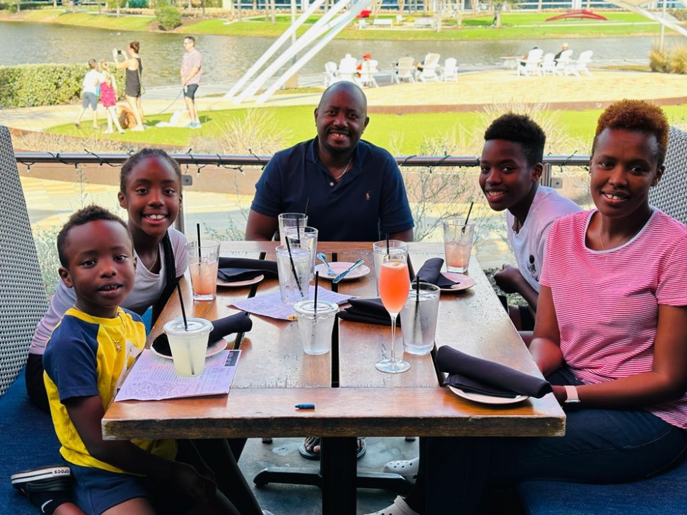 The youngster hails from a quite athletic Rwandan family. His mother Rosine (R) played volleyball, while his father Mike (C) played tennis. His younger sister Kelia (second left), plays tennis.