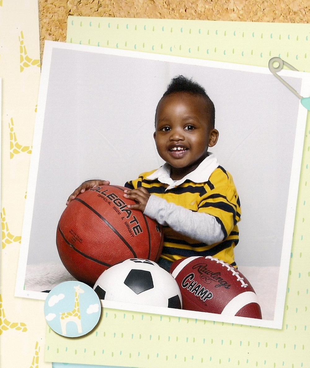 From a young age, Kenrik's parents exposed him to sports. Here, he is posing with a basketball at age 2.