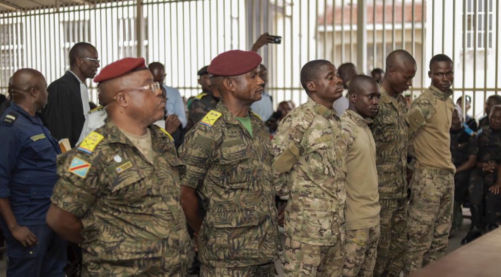 Six soldiers appeared in court , in the eastern DR Congo city of Goma accused of involvement in the killing of more than 40 people. Internet