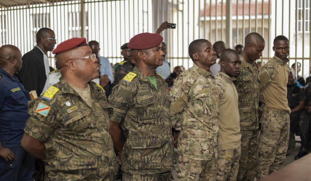 Six soldiers appeared in court , in the eastern DR Congo city of Goma accused of involvement in the killing of more than 40 people. Internet