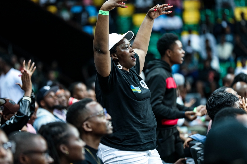 Mpoyo's mother is pictured celebrating as she watched her son steer APR to yet another win over REG on Wednesday night-Dan Gatsinzi Mpoyo's mother is pictured celebrating as she watched her son steer APR to yet another win over REG on Wednesday night-Dan Gatsinzi