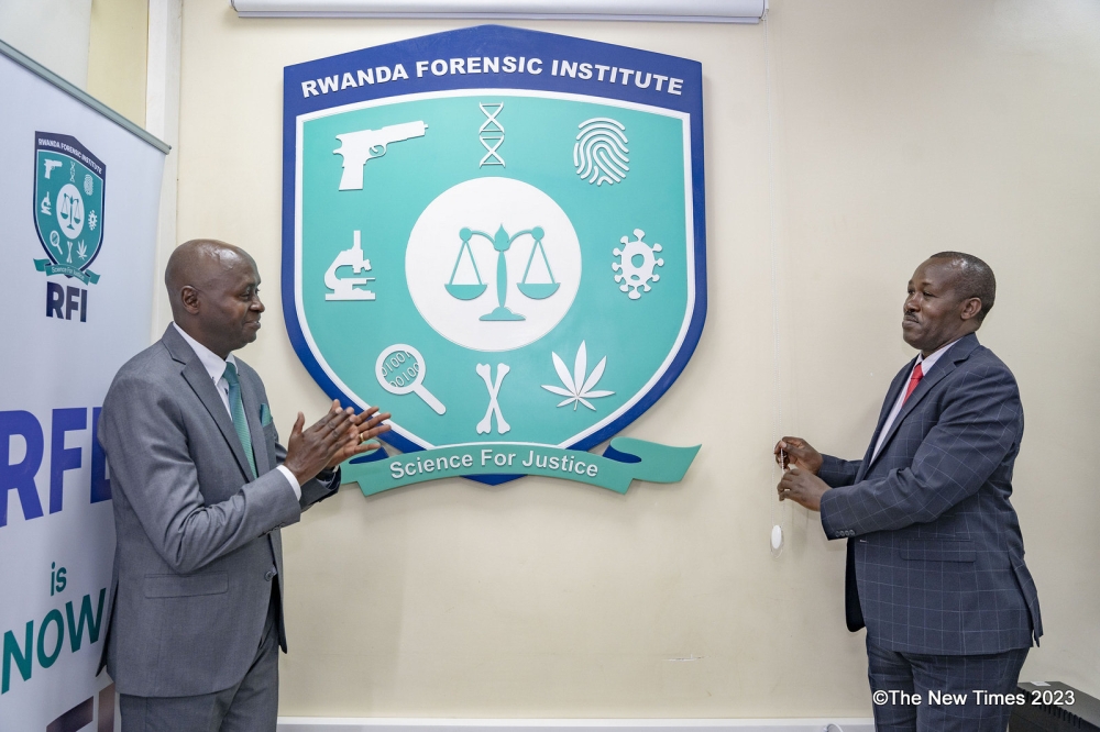 Lt. Col. Charles Karangwa, the Director General of Rwanda Forensic Institute (left), and Anastase Nabahire, Coordinator
of the Justice Sector Secretariat at the Ministry of Justice, during the launch of the institute’s new name on Thursday, September 7. Photo: Emmanuel Dushimimana