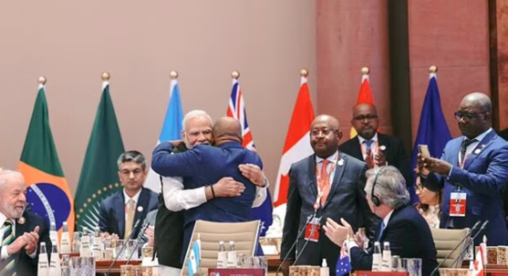 New Delhi: Prime Minister Narendra Modi hugs President of the Union of the Comoros and Chairperson of the African Union (AU) Azali Assoumani as the latter takes his seat after the Union became a permanent member of the G20 during the G20 Summit 2023 at the Bharat Mandapam, in New Delhi, Saturday, Sept. 9, 2023. (PTI Photo) (PTI)