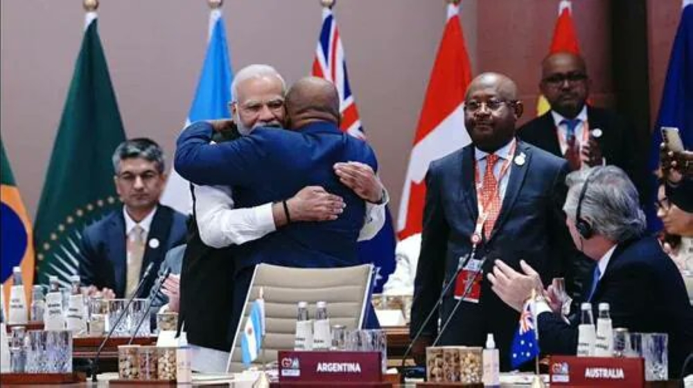 New Delhi: Prime Minister Narendra Modi hugs President of the Union of the Comoros and Chairperson of the African Union (AU) Azali Assoumani as the latter takes his seat after the Union became a permanent member of the G20 during the G20 Summit 2023 at the Bharat Mandapam, in New Delhi, Saturday, Sept. 9, 2023. (PTI Photo)