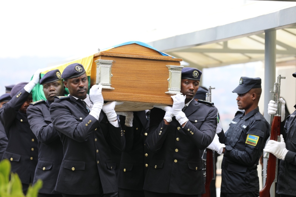 Officers carry the body of William Ntidendereza to the Senate Plenary Chamber as  members of parliament  pay final tributes to the late senator on Monday, September 11. Photos by Emmanuel Dushimimana