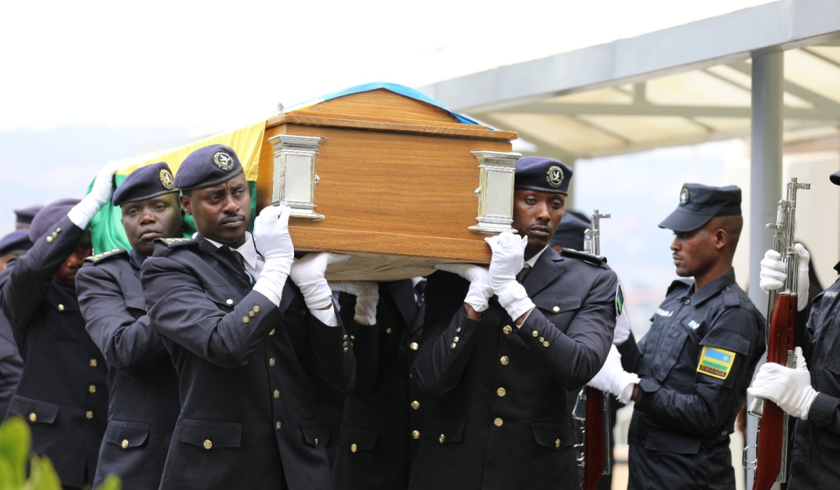Officers carry the body of William Ntidendereza to the Senate Plenary Chamber as  members of parliament  pay final tributes to the late senator on Monday, September 11. Photos by Emmanuel Dushimimana