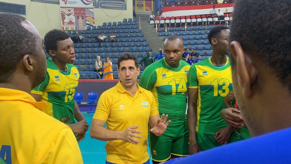 Rwanda volleyball national team head coach Paulo De Tarso gives instructions to the players in Cairo. Courtesy
