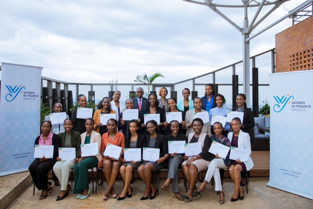 Officials pose for a group photo with twenty women who were given scholarships  after completing a six-month one-year programme on September 13. Courtesy