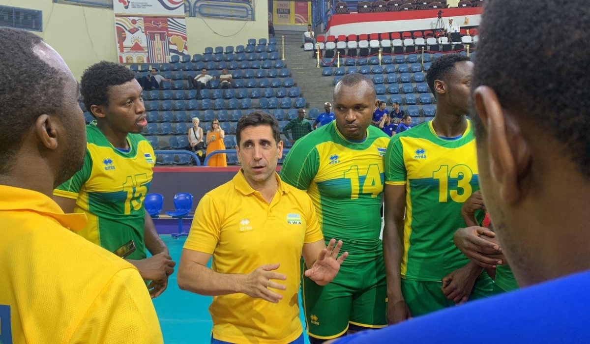 Rwanda volleyball national team head coach Paulo De Tarso gives instructions to the players in Cairo. Courtesy