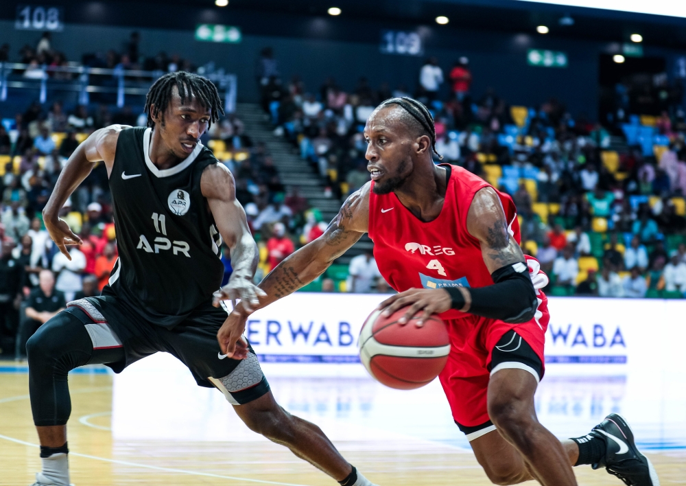 Adonis Filer tries to go past Nshobozwabyosenumukiza.  APR BBC star Jean Jacques Wilson Nshobozwabyosenumukiza will be the captain during All-Stars Game. Photo by Dan Kwizera
