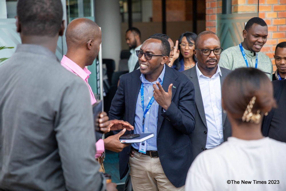 I&M Bank Rwanda CEO, Benjamin Mutimura interacts with delegates as the bank hosts the European Business Chamber of Rwanda (EBCR) and the American Chamber of Commerce in Rwanda  members. Dan Gatsinzi