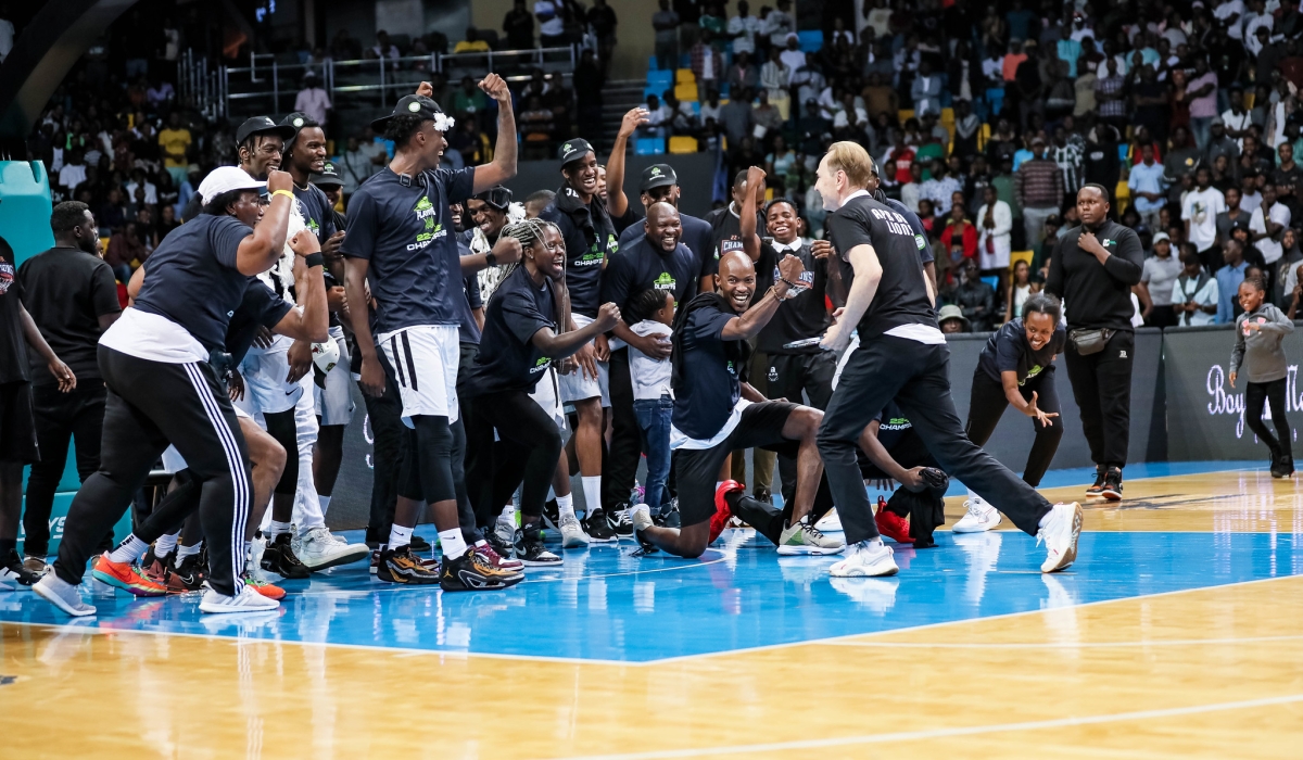 APR BBC head coach Mazen Trakh, the American tactician, celebrates with players after winning Rwanda National Basketball League. Dan Gatsinzi