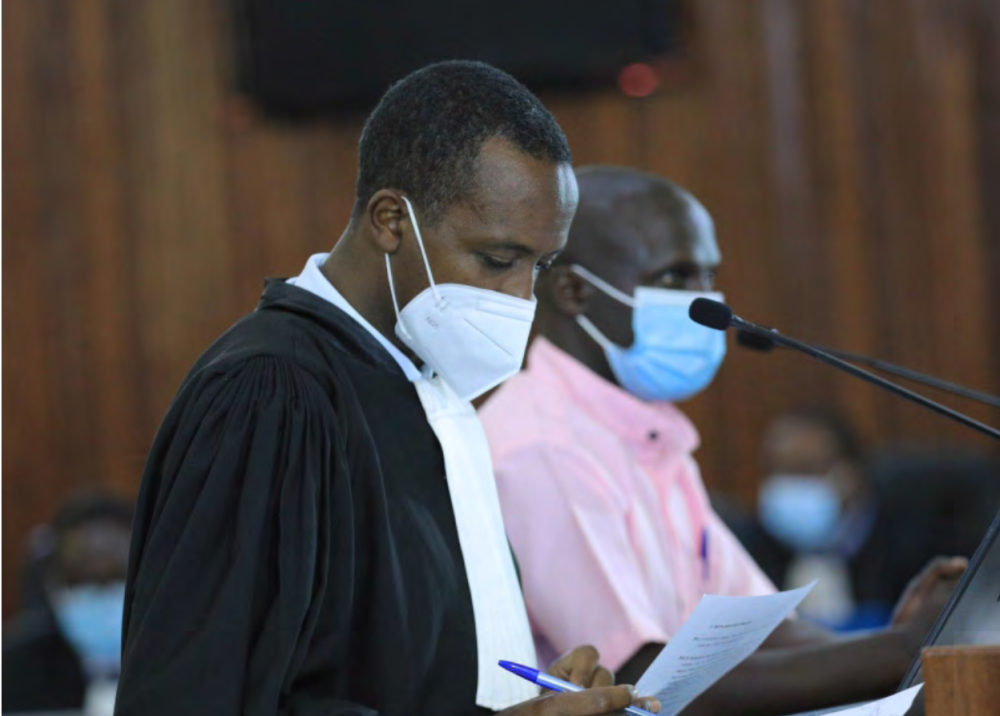 A lawyer assists his client during a hearing session at FLN trial in Kigali on May 7, 2021. PHOTO BY SAM NGENDAHIMANA