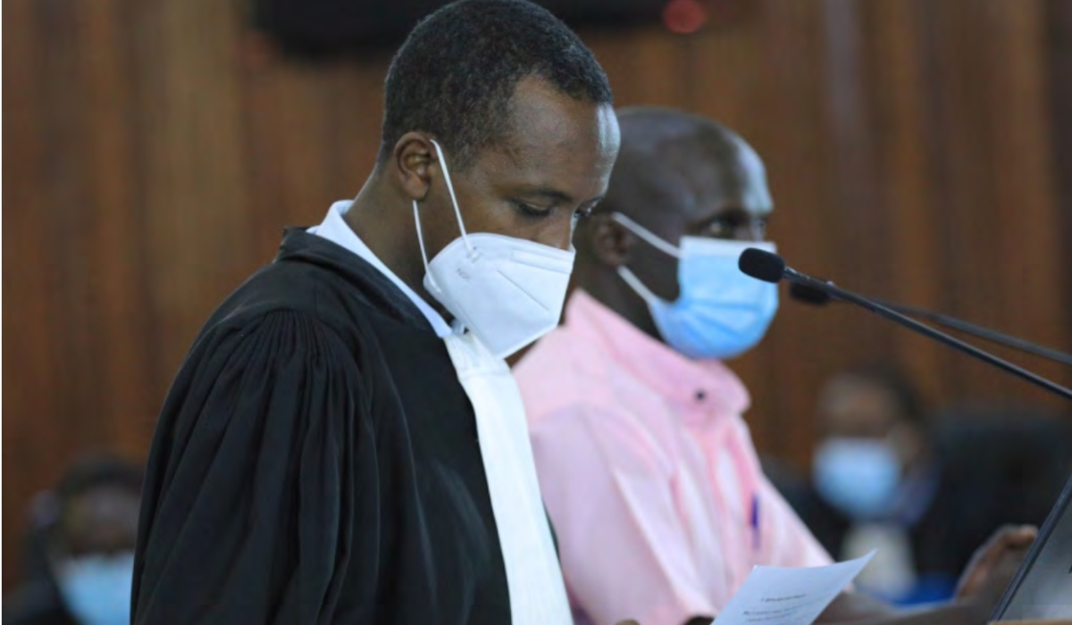 A lawyer assists his client during a hearing session at FLN trial in Kigali on May 7, 2021. PHOTO BY SAM NGENDAHIMANA
