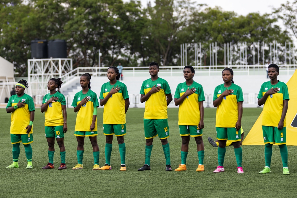 Rwanda national women&#039;s football team sing the national anthem before facing Ghana at Kigali Pele Stadium on September 20. Photo by Christianne Murengerantwari