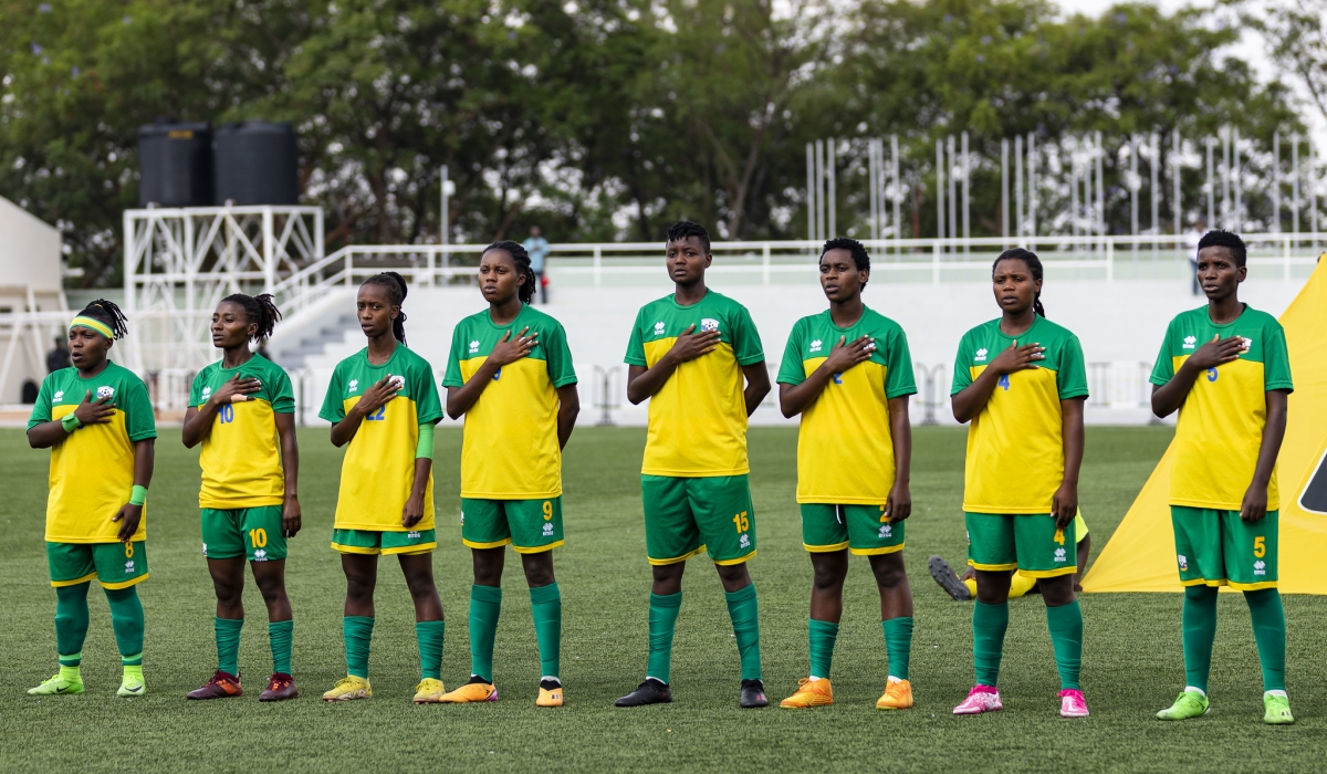 Rwanda national women&#039;s football team sing the national anthem before facing Ghana at Kigali Pele Stadium on September 20. Photo by Christianne Murengerantwari