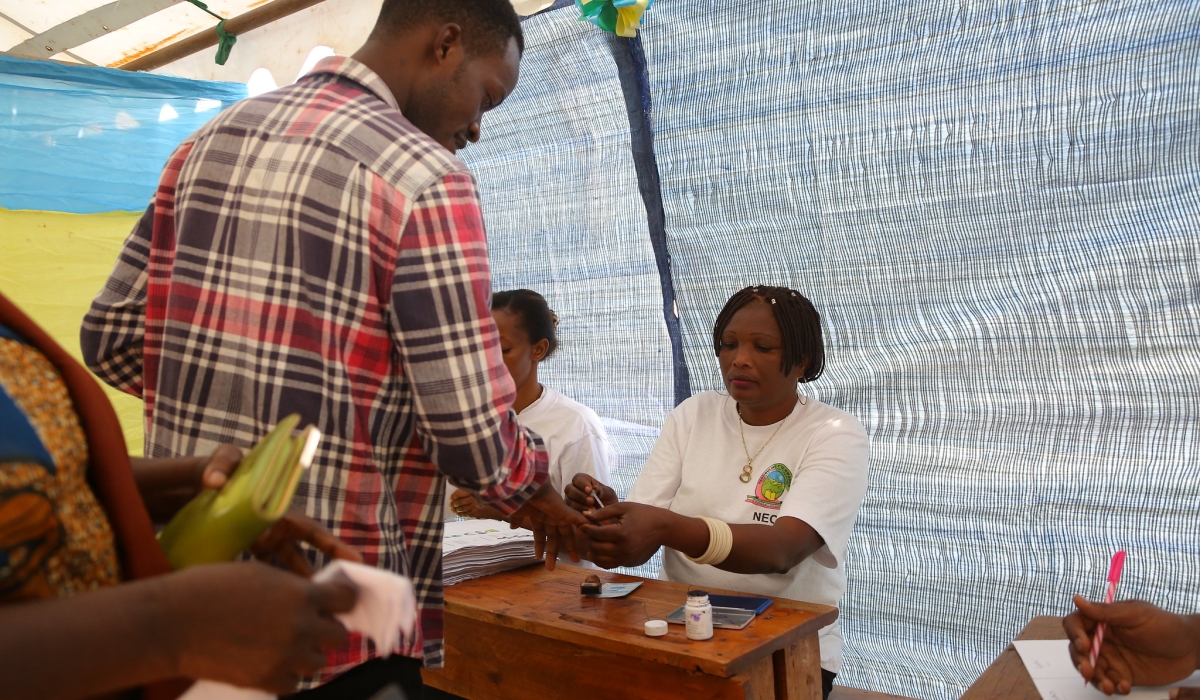 National Electoral Commission&#039;s volunteers help voters during the past elections in Gasabo district. Sam Ngendahimana