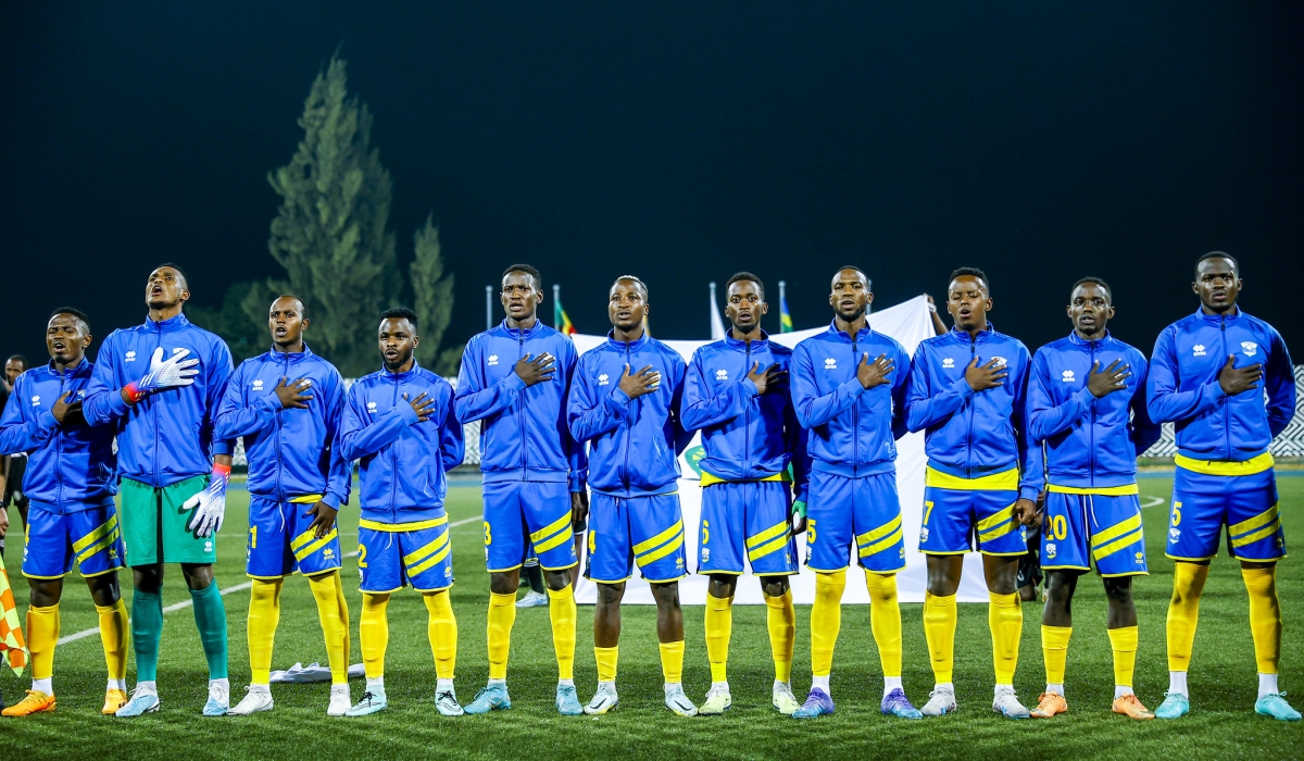 National football team players sing the national anthem before facing Senegal at Huye Stadium. Photo by Olivier Mugwiza
