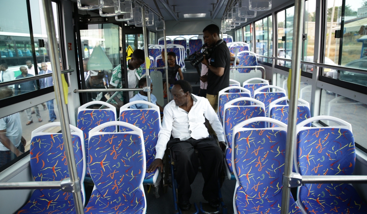 Passengers board a bus in Kigali.The City of Kigali is set to roll out a pilot phase for the Dedicated Bus Lane (DBL) system as a means of making public transport better. Craish Bahizi