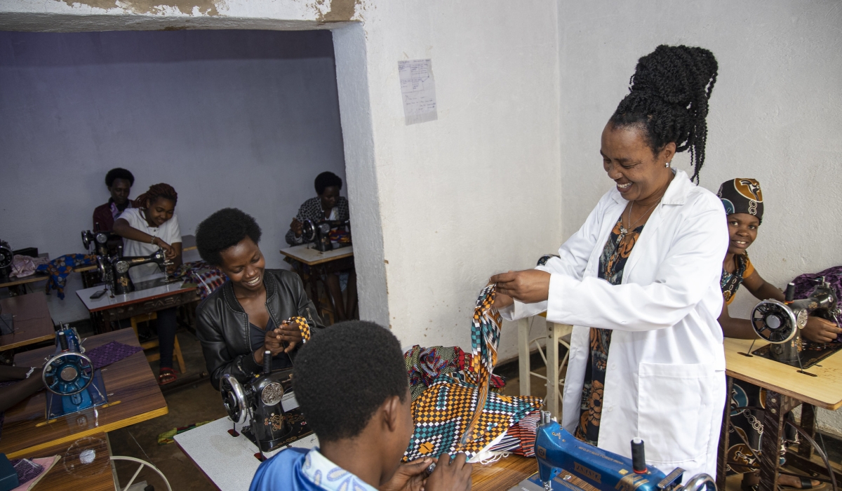 Niyomugenga&#039;s mother Chantal Mukasharangabo during a training session of tailors . She  is one of one of trainers at the school.