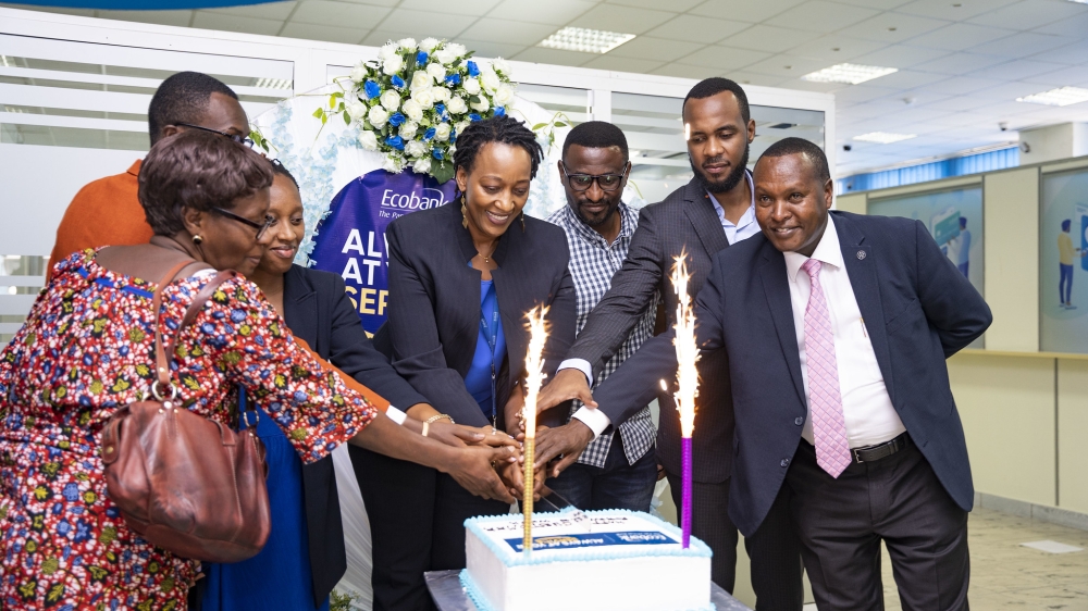 Ecobank Rwanda officials and customers cut a cake to launch Customer Service Week on Monday, October 2 . Photos by Emmanuel Dushimimana