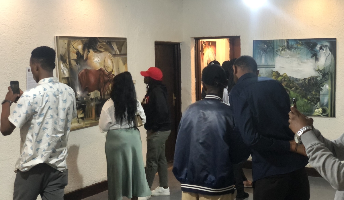 Attendants while viewing the paintings at the Heritage art exhibition at Neza-h art Space-Kiyovu.  Courtesy photos. 
