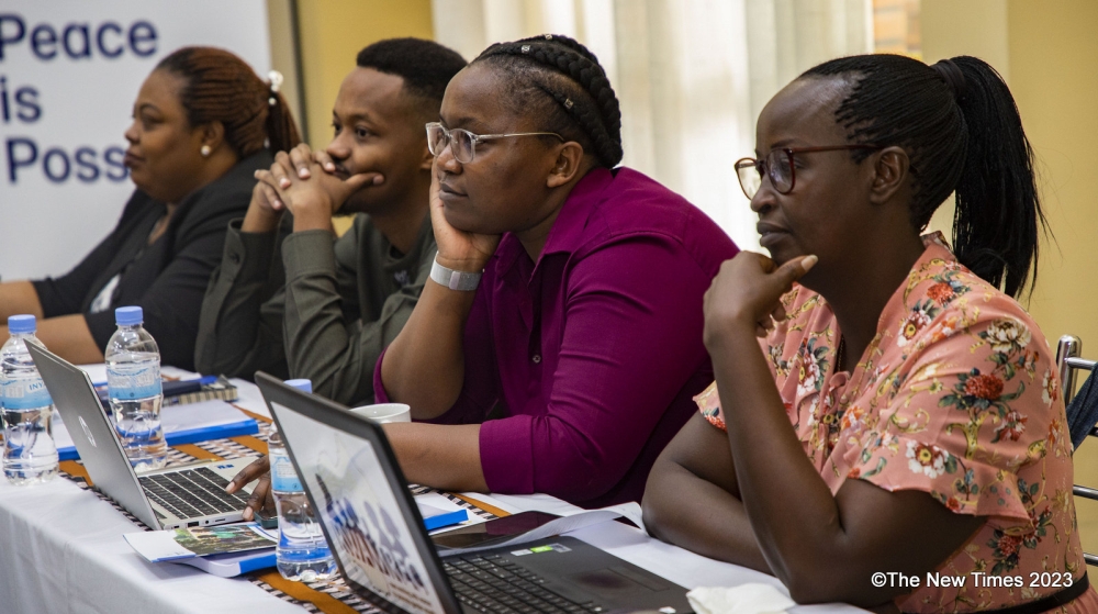 Participants follow a presentation during the session on the newly designed curriculum that has been created to promote positive masculinity and positive parenting in the country. All photos by Emmanuel Dushimimana