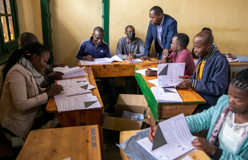 Some teachers marking the national exams at GSO Butare Indatwa in Huye. Some of them countrywide have raised concerns about delayed payments since August after completing their tasks. PHOTO BY OLIVIER MUGWIZA