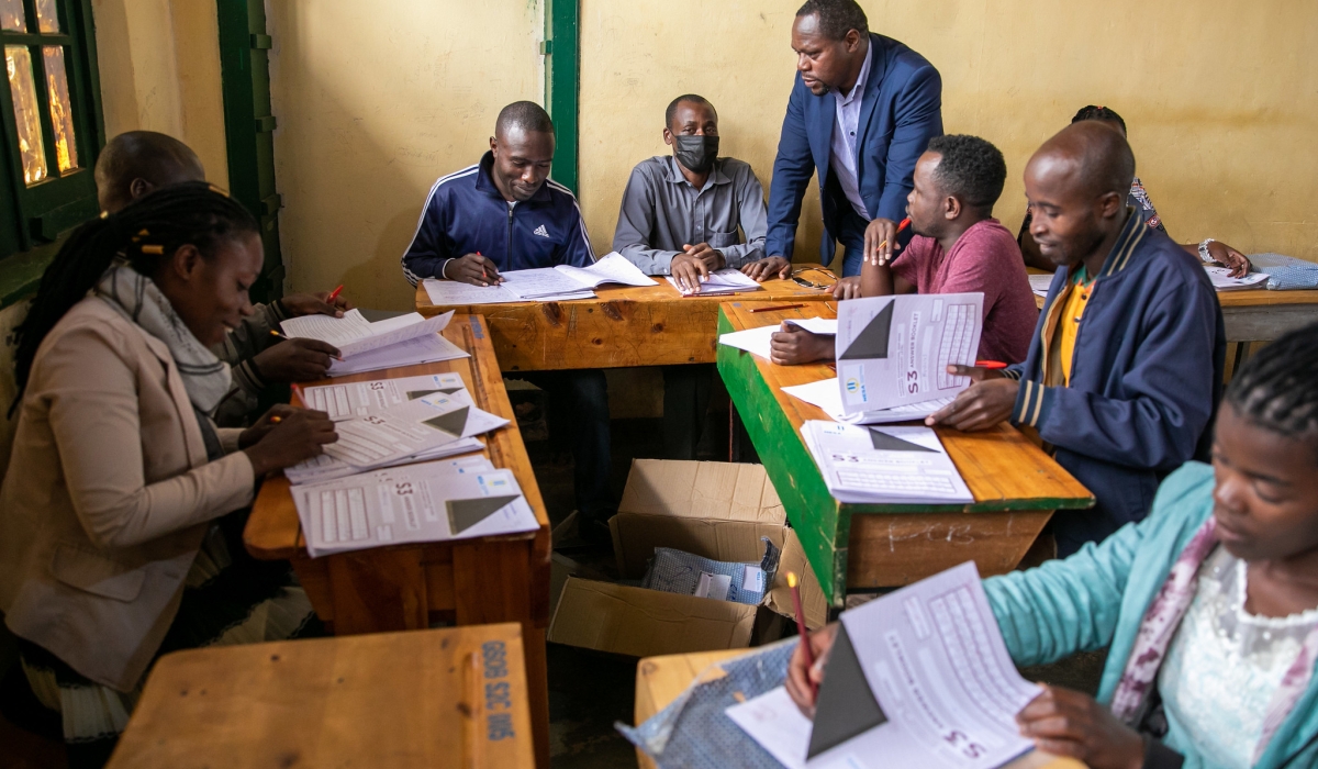 Some teachers marking the national exams at GSO Butare Indatwa in Huye. Some of them countrywide have raised concerns about delayed payments since August after completing their tasks. PHOTO BY OLIVIER MUGWIZA