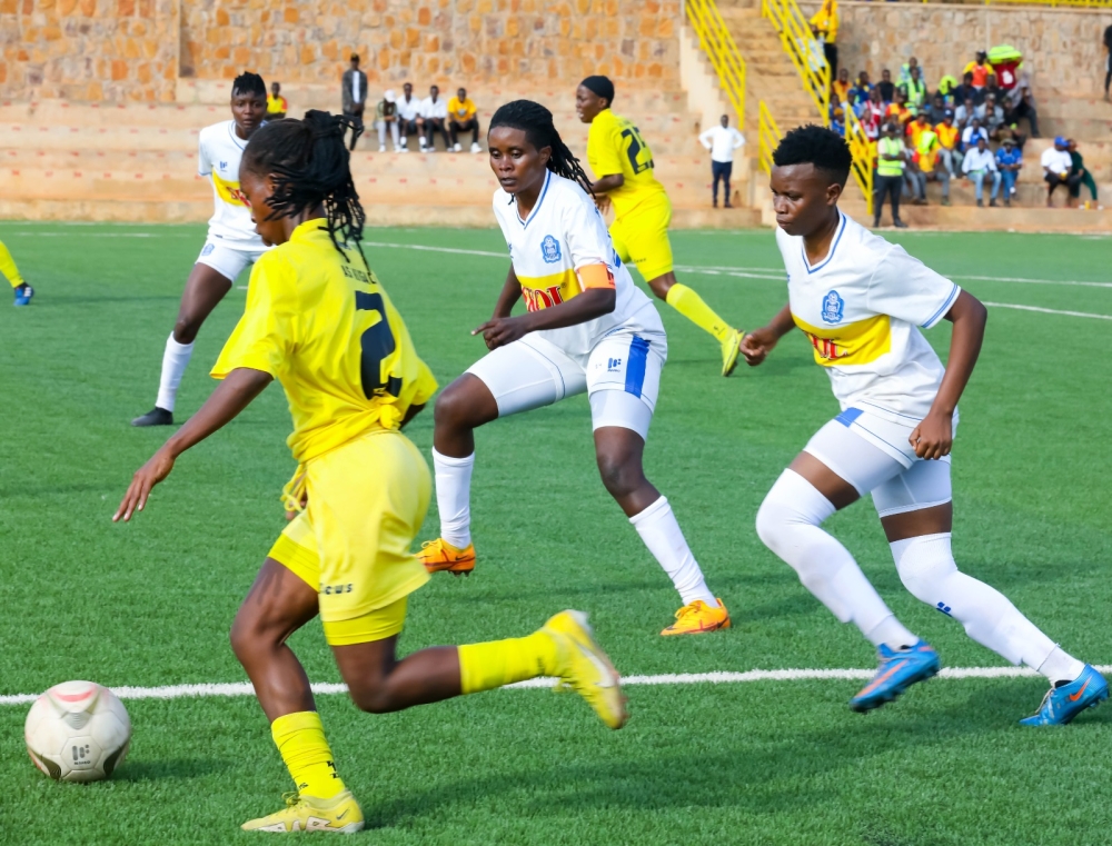 AS Kigali player wins the ball against Rayon Sports WFC during a 1-1 draw at Nzove SKOL Stadium on Saturday October 14. ALL PHOTOS BY CRAISH BAHIZI