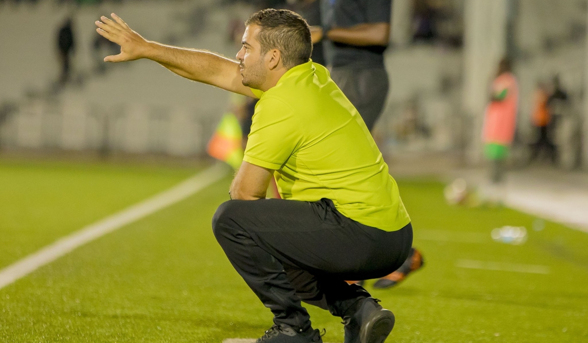 Kiyovu Sports head coach Petros Koukouras communicates to his players during a 2-1 game against Marine FC at Kigali Pele stadium on Saturday. Courtesy