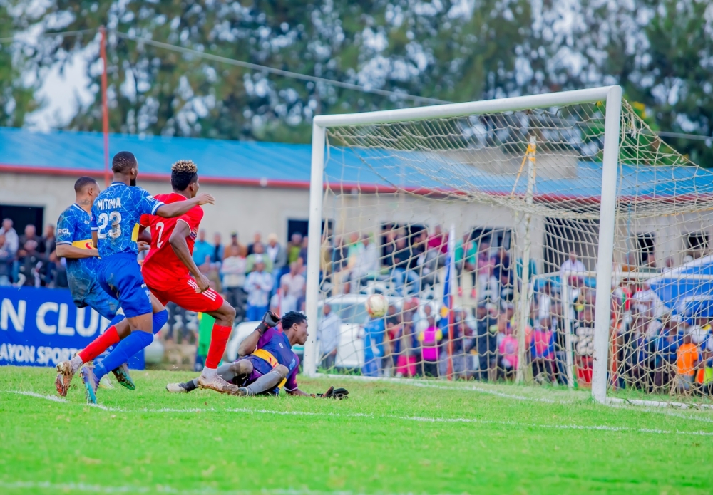 Rayon Sports goalkeeper Simon Tamale looks back in the nets  as he fails to stop Musanze Fc striker Peter Agblevor&#039;s goal during a 0-1 game at Ubworoherane stadium. Photo by Christophe Renzaho