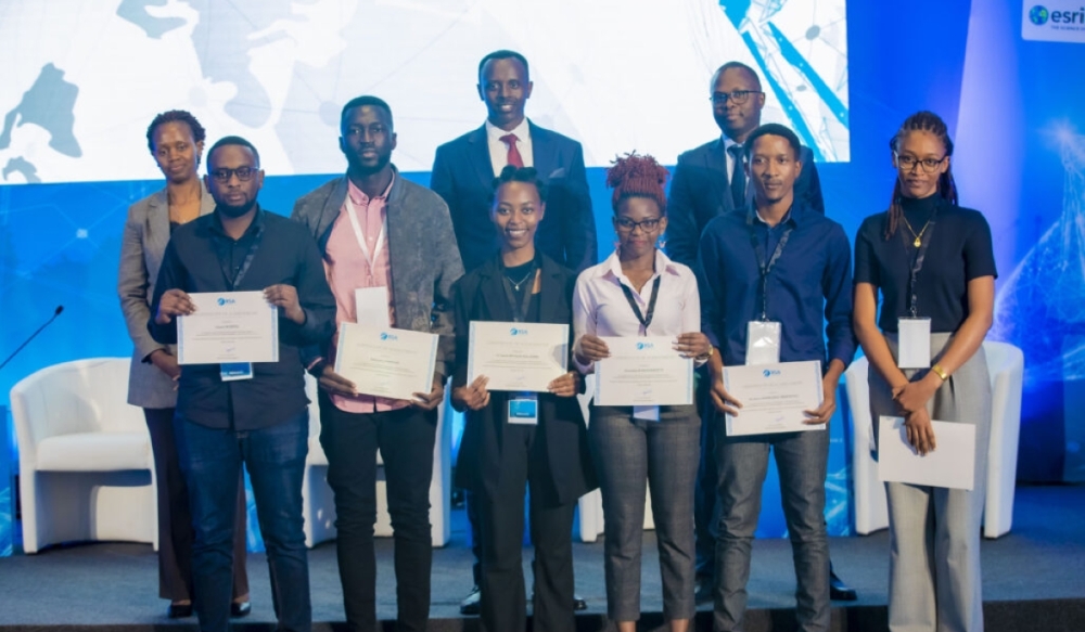 Rwandan students receiving certificates of achievement for the project, flanked by the Rwanda Space Agency CEO, CFO, and CTO. Courtesy RSA