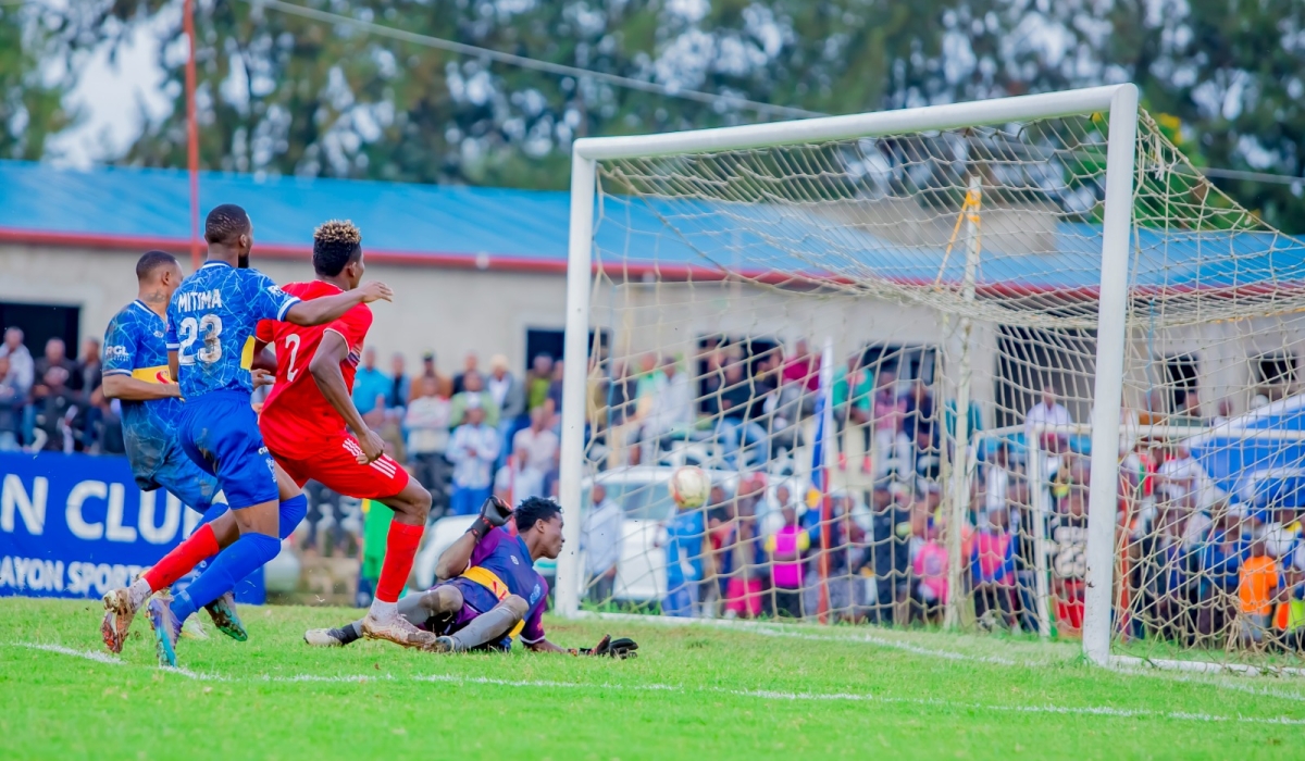 Rayon Sports goalkeeper Simon Tamale looks back in the nets  as he fails to stop Musanze Fc striker Peter Agblevor&#039;s goal during a 0-1 game at Ubworoherane stadium. Photo by Christophe Renzaho