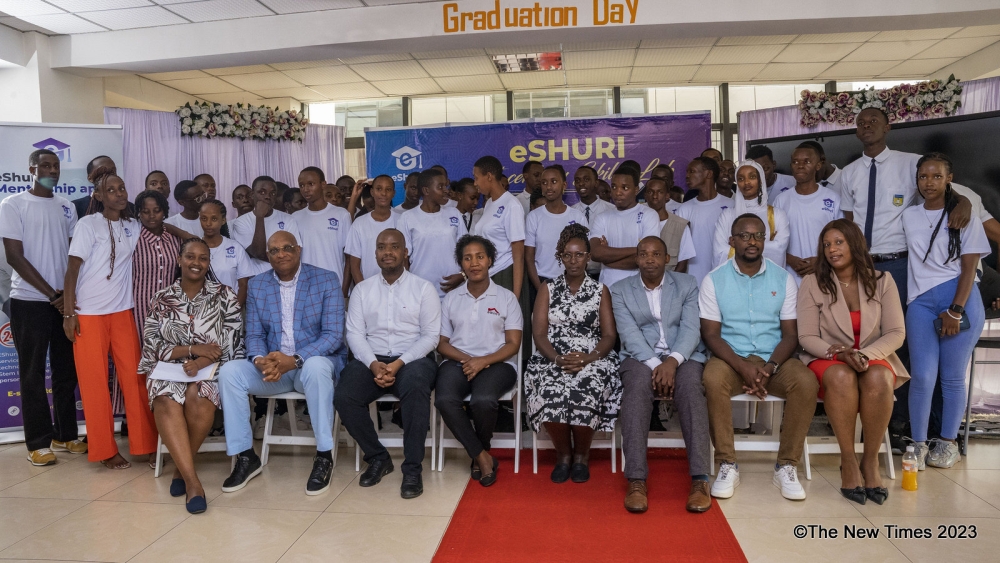 Officials pose for a group photo with some of the 75 high school graduates and seniors who completed hands-on software training at eShuri 21st
Century Skills Lab Programme, provided by Data Systems Limited. All photos: Emmanuel Dushimimana