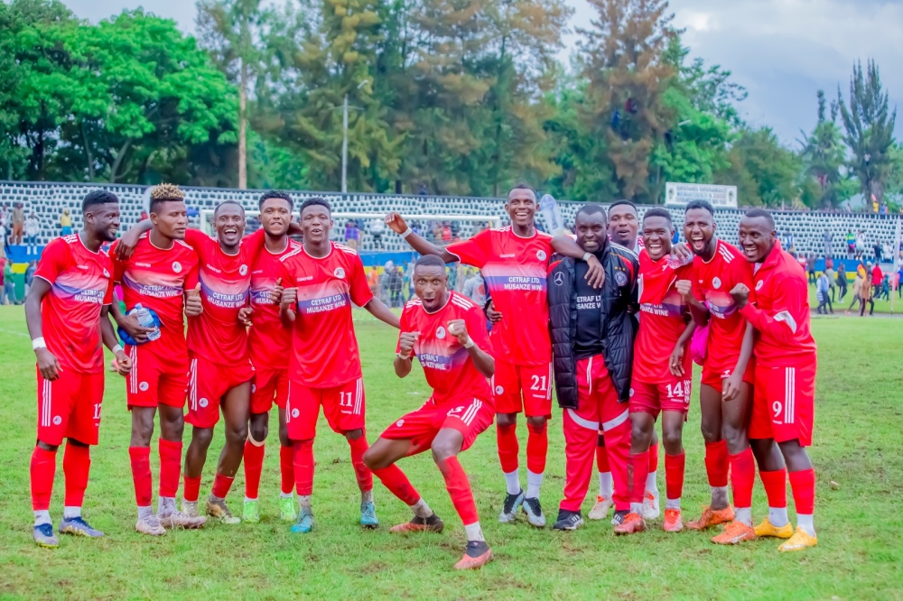 Musanze coach Sosthene Habimana with the players as they celebrate a 1-0 win over Rayon Sports at Ubworoherane Stadium on Saturday, October 14. Photo by Christophe Renzaho