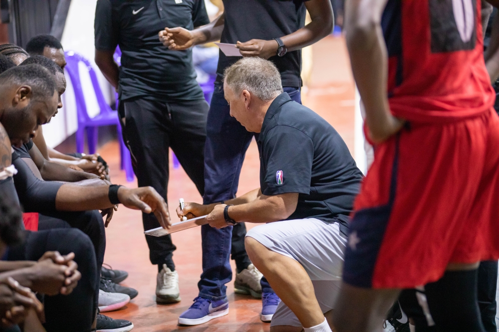 Rwanda Energy Group (REG) head coach Dean Murray gives instructions to his players. Dan Gatsinzi
