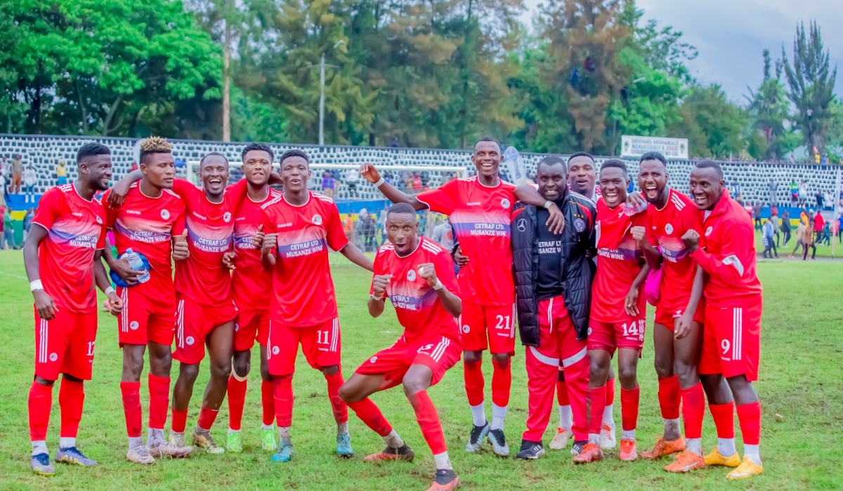 Musanze coach Sosthene Habimana with the players as they celebrate a 1-0 win over Rayon Sports at Ubworoherane Stadium on Saturday, October 14. Photo by Christophe Renzaho