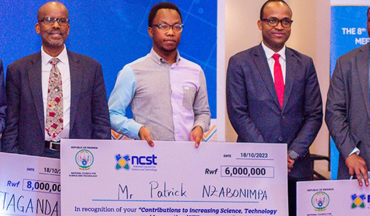 The New Times reporter Patrick Nzabonimpa (C) with Prof Jean Pierre Ntaganda(L) and Minister of Education Gaspard Twagirayezu pose for a photo. Journalist Nzaponimpa was awarded  for his contribution to the awareness of science, technology and innovation in Rwanda on Wednesday, October 18. Courtesy